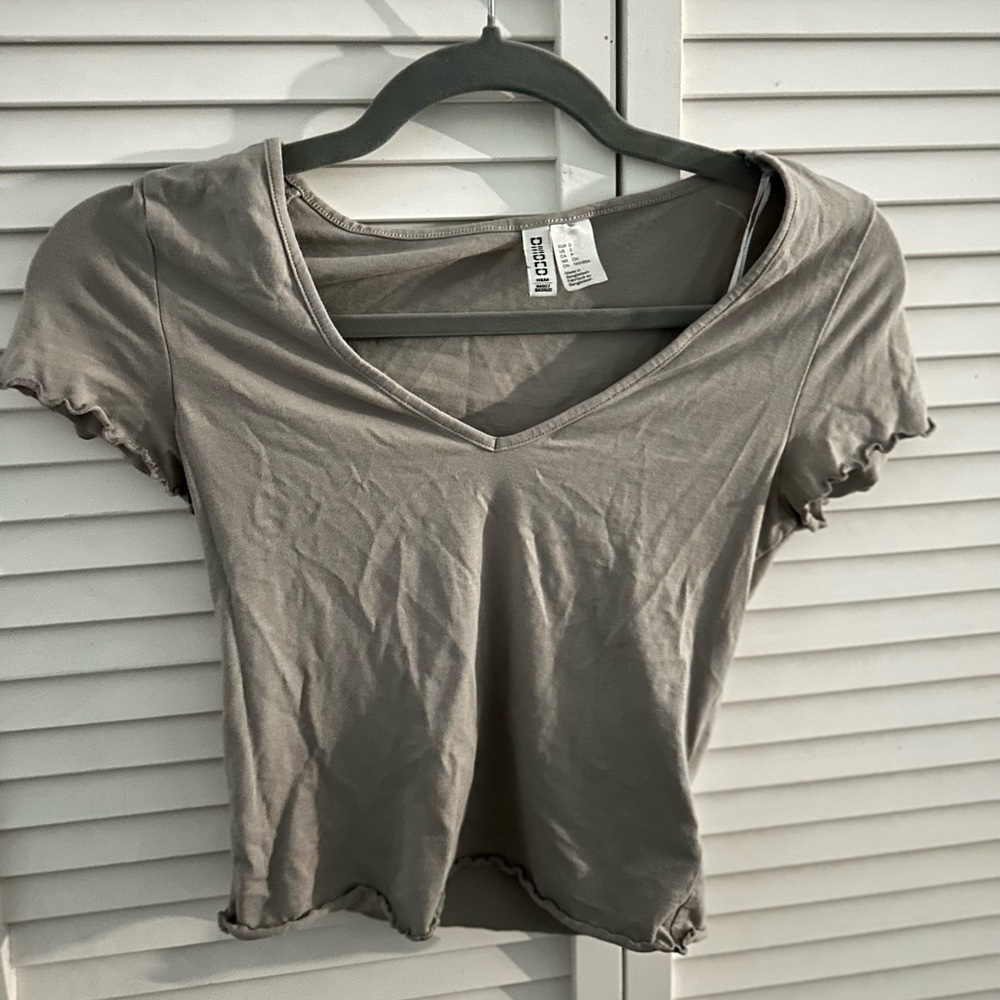 H&M- basic grey tee with slight ruffle on arms and waist of shirt
